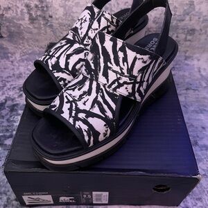 Sorel Black and White Platform Sandals with Bold Design